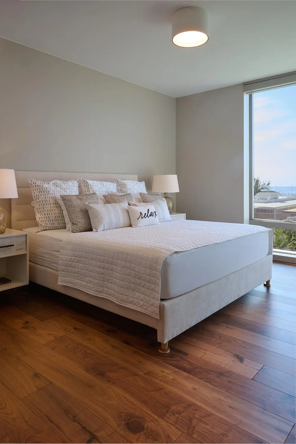 Bedroom with wide-plank walnut hardwood flooring